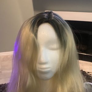 Blond with dark roots, long, synthetic wig.
